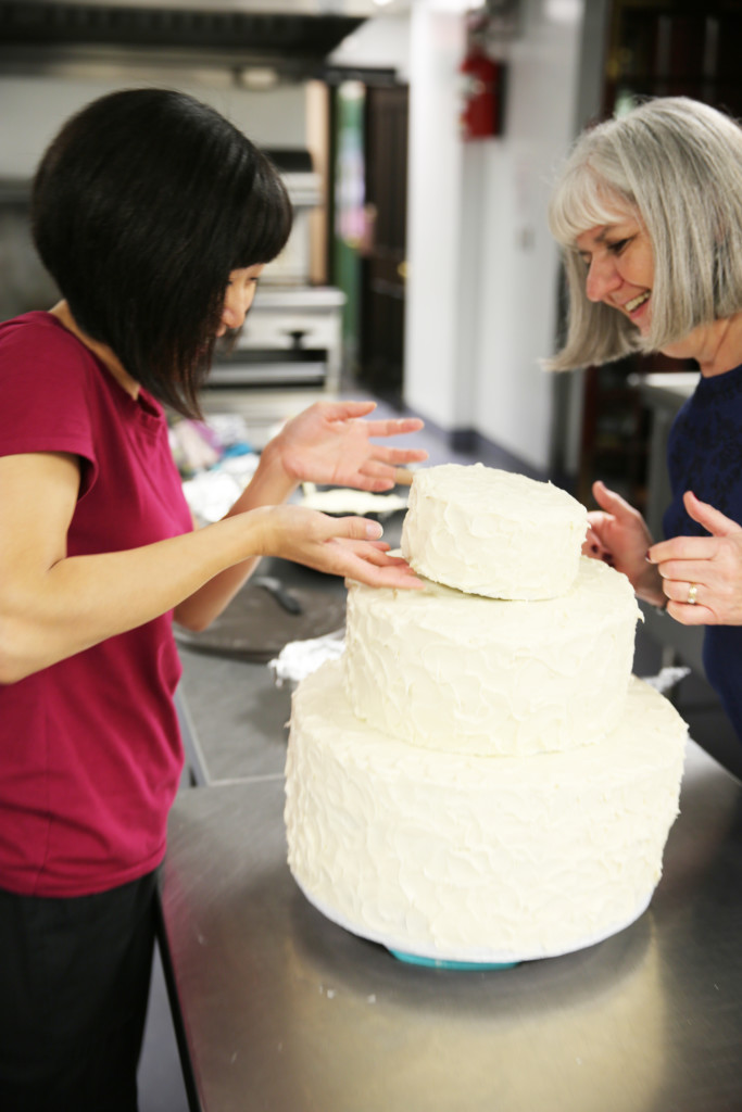 Emily decorating the cake